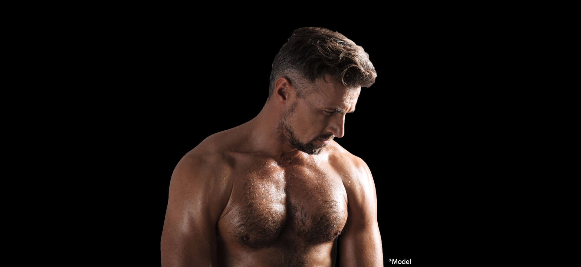 Close up portrait of a muscular mature shirtless sportsman